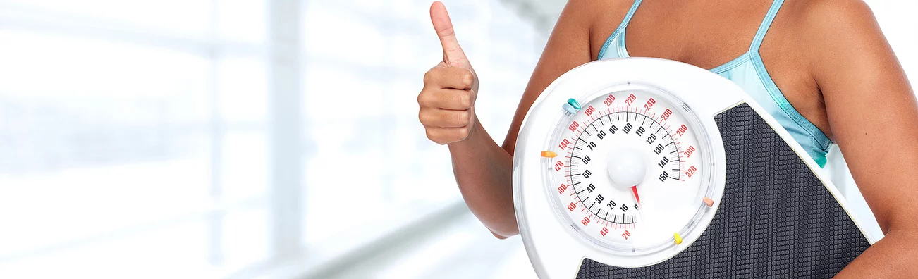 Women Thumbs Up with Weight Scale